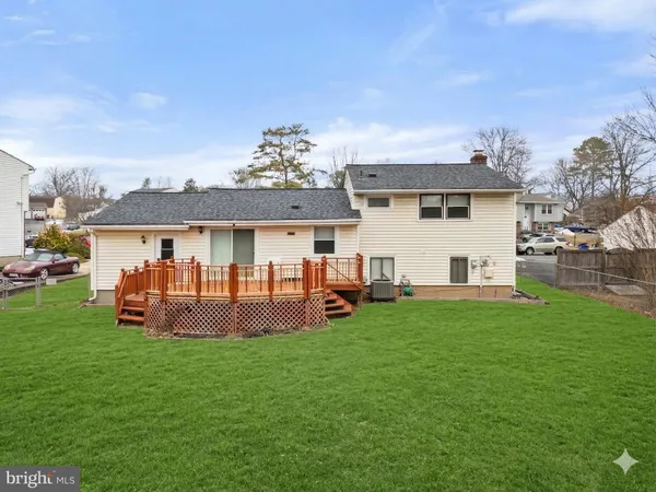 a front view of house with a garden and patio