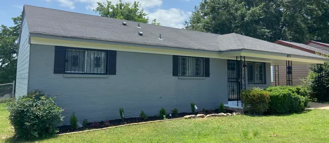 a backyard of a house with lots of green space