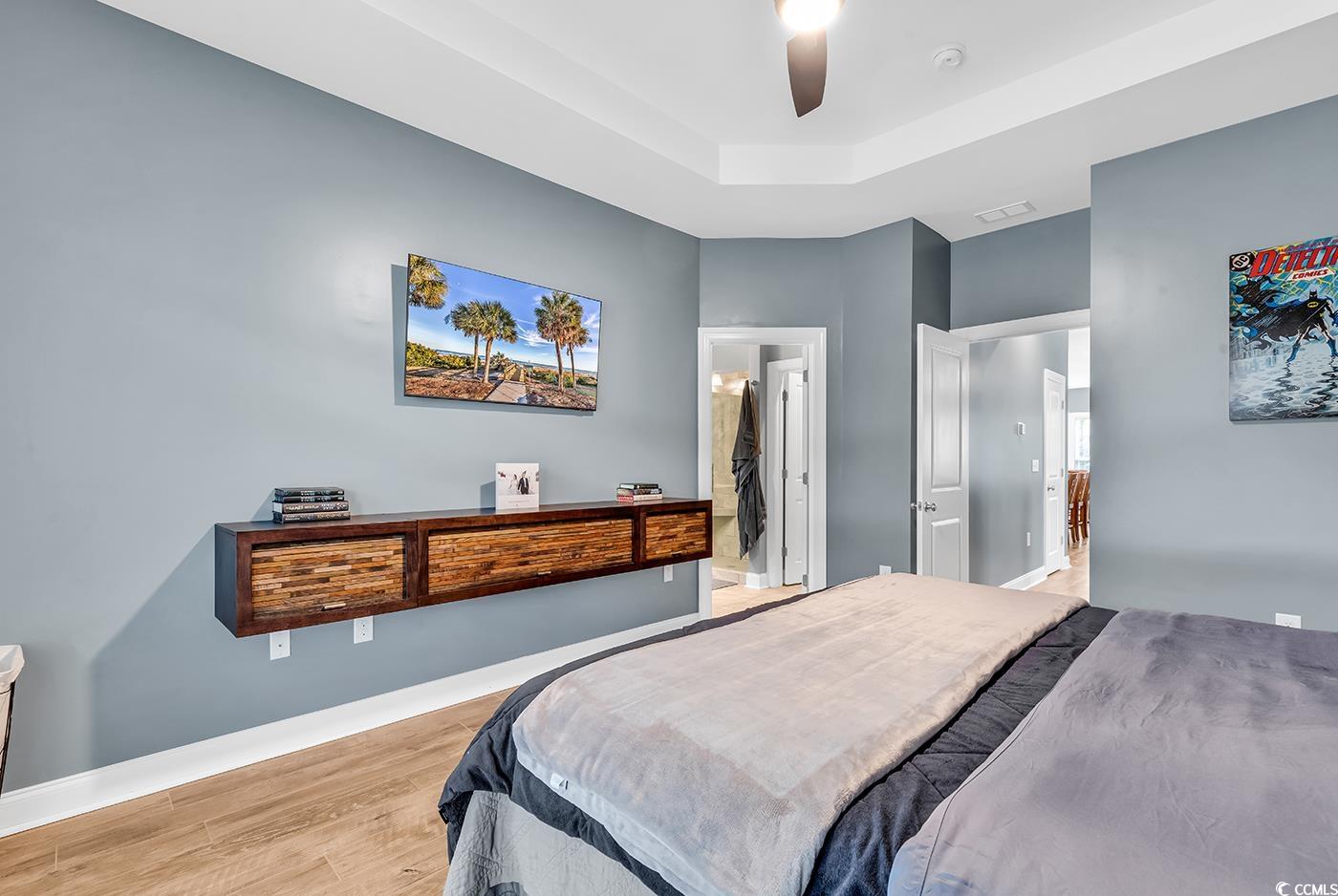28 Pinnacle Drive Murrells Inlet, SC 29576 - Photo 20 of 40 Bedroom featuring a raised ceiling, ensuite bath,