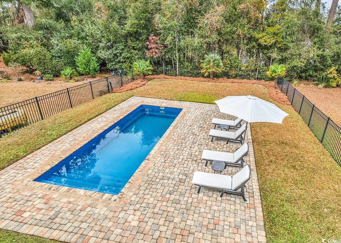 28 Pinnacle Drive Murrells Inlet, SC 29576 - Photo 2 of 40 View of swimming pool with a patio area and a yard