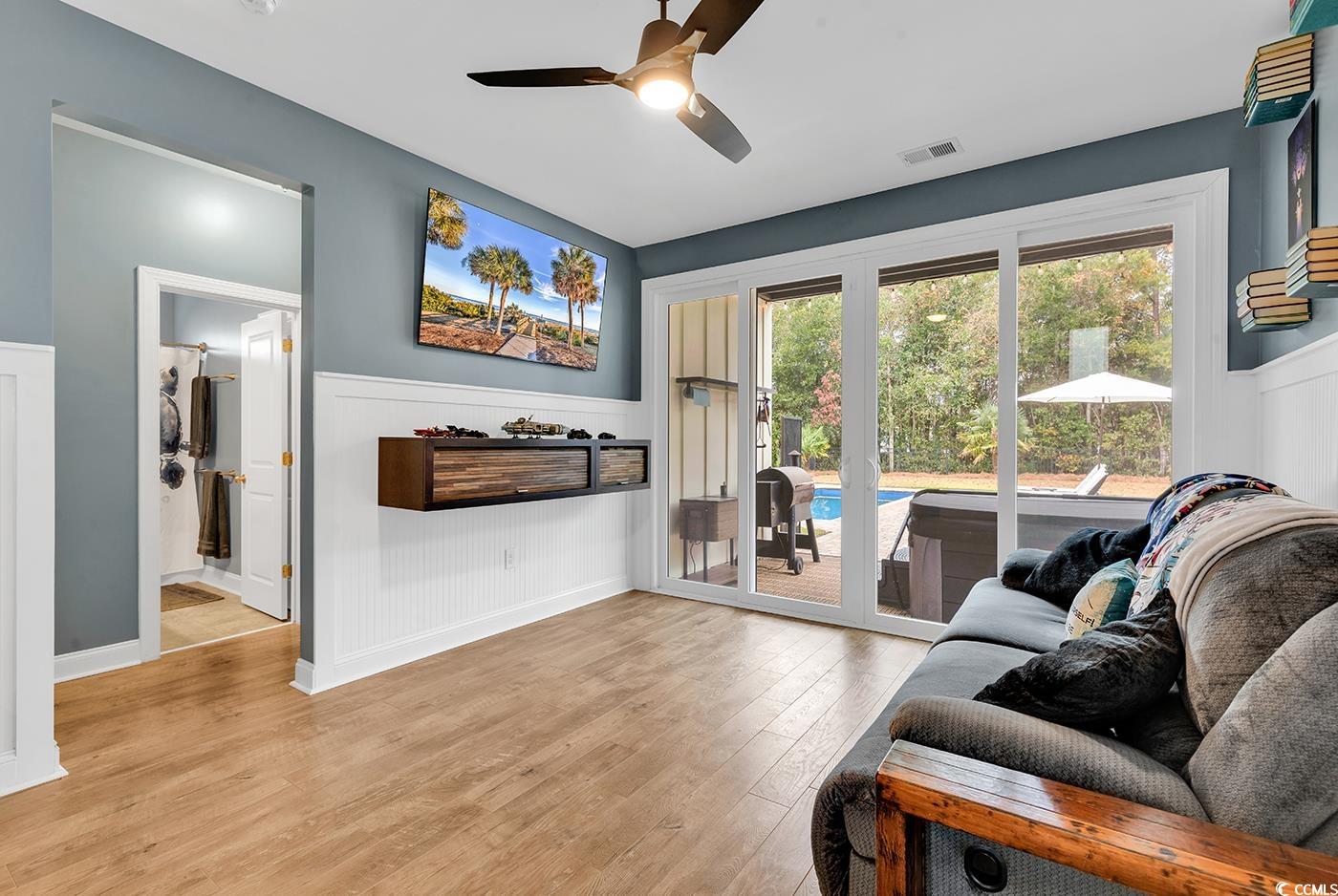 28 Pinnacle Drive Murrells Inlet, SC 29576 - Photo 25 of 40 Living room featuring ceiling fan and light wood-t