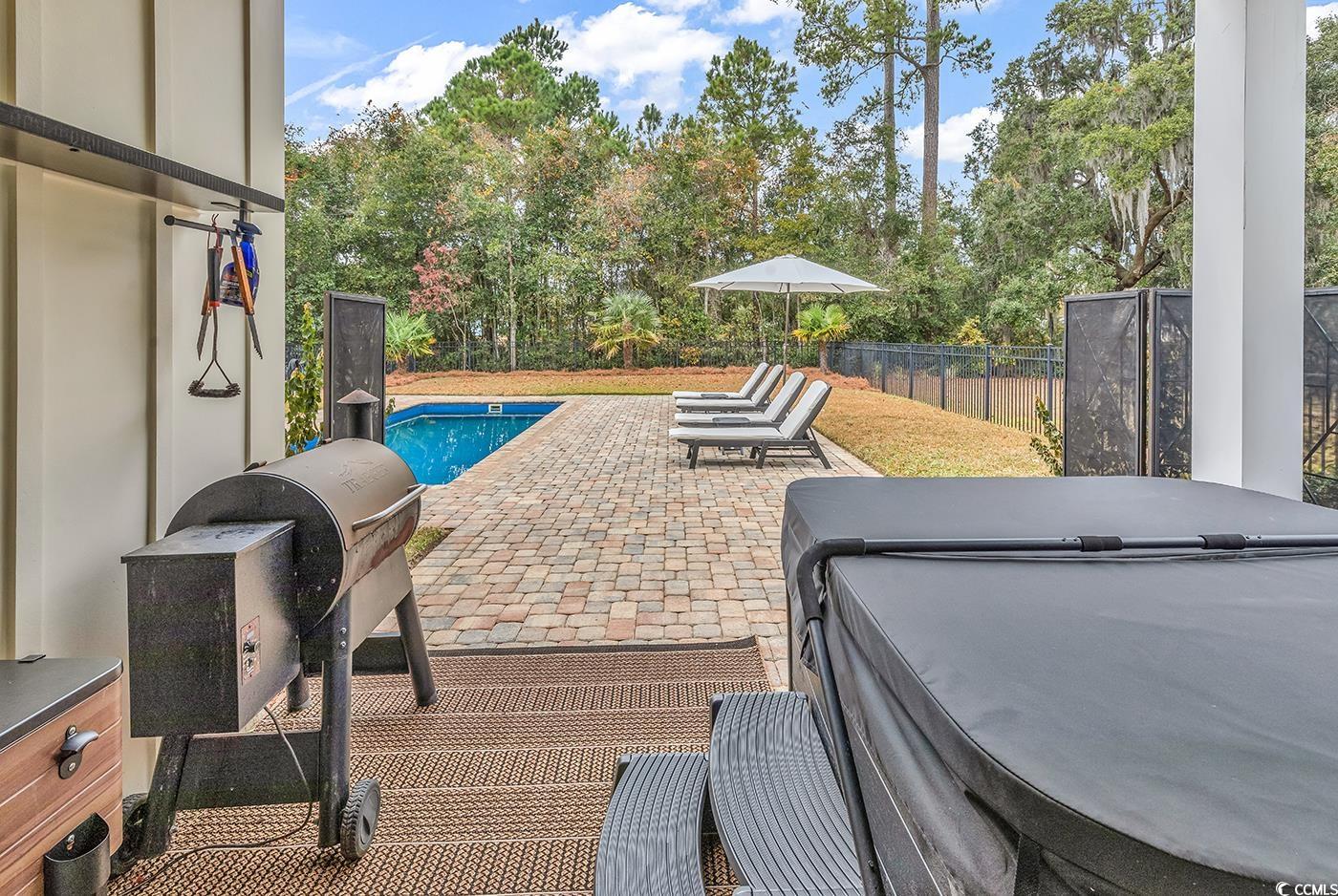 28 Pinnacle Drive Murrells Inlet, SC 29576 - Photo 26 of 40 View of patio / terrace featuring a pool with hot