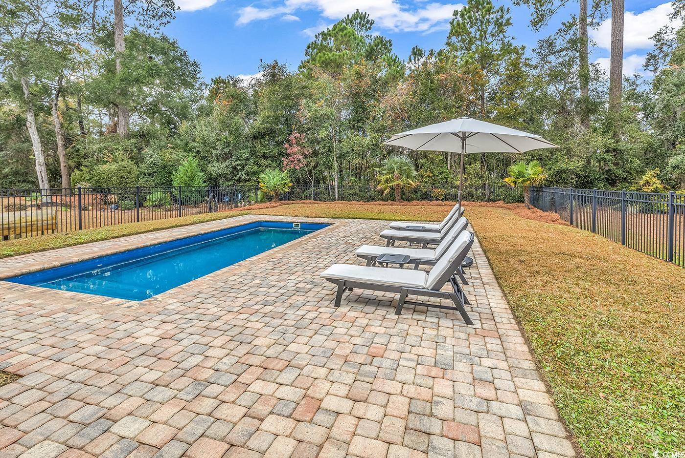 28 Pinnacle Drive Murrells Inlet, SC 29576 - Photo 27 of 40 View of swimming pool featuring a patio area