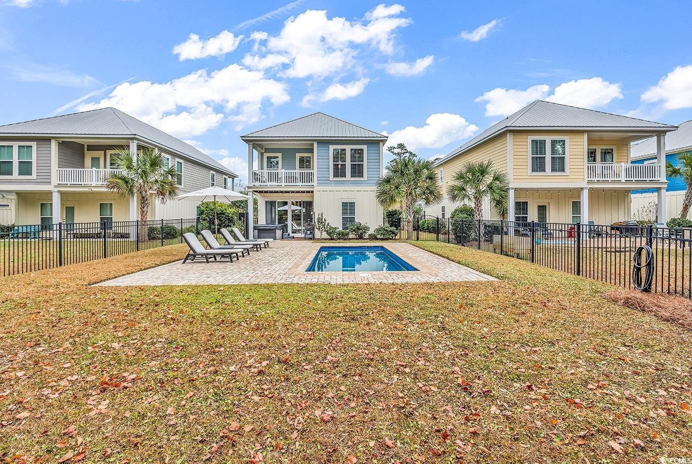 28 Pinnacle Drive Murrells Inlet, SC 29576 - Photo 29 of 40 Rear view of house with a patio, a fenced in pool,