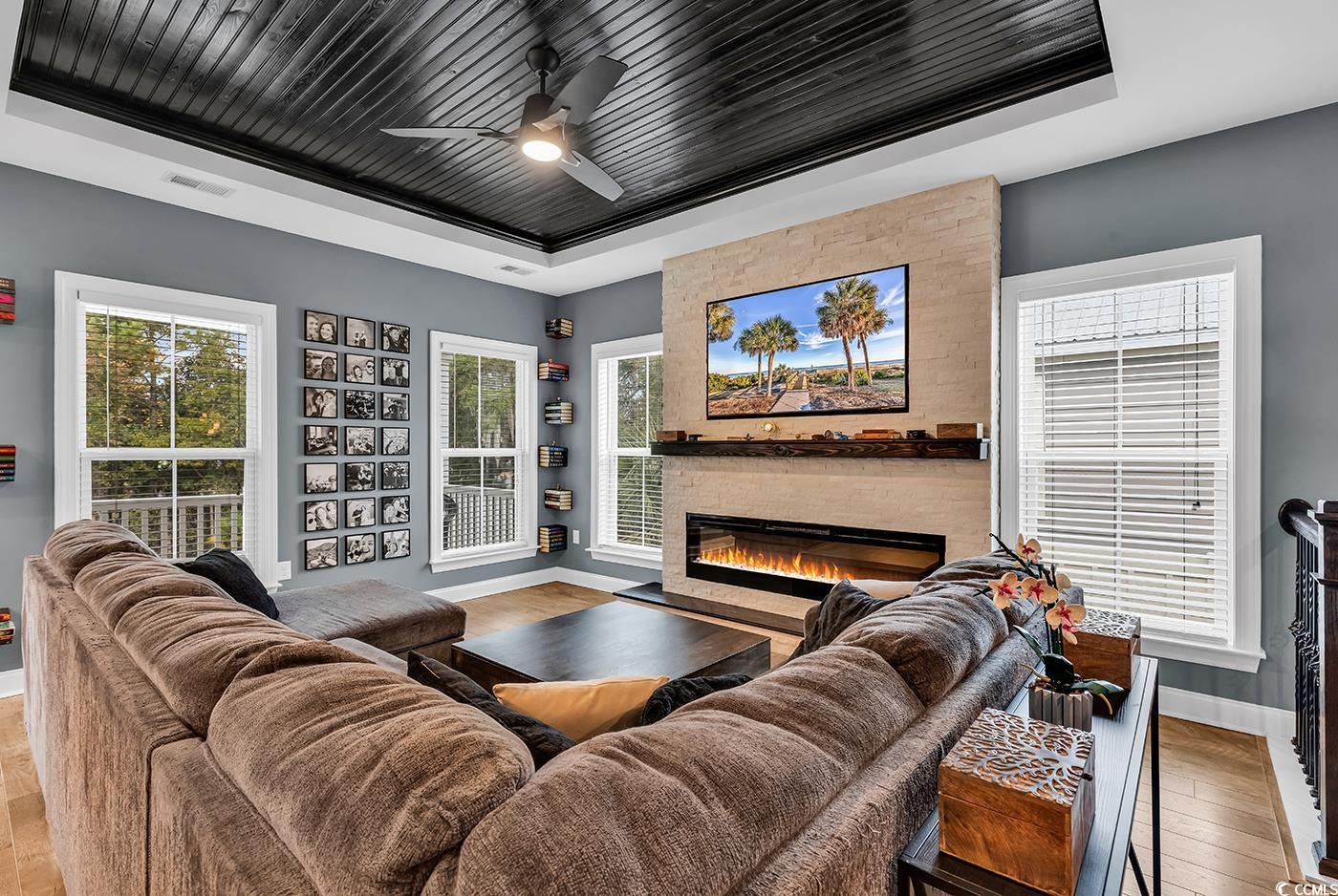 28 Pinnacle Drive Murrells Inlet, SC 29576 - Photo 6 of 40 Living room featuring a tray ceiling, a wealth of