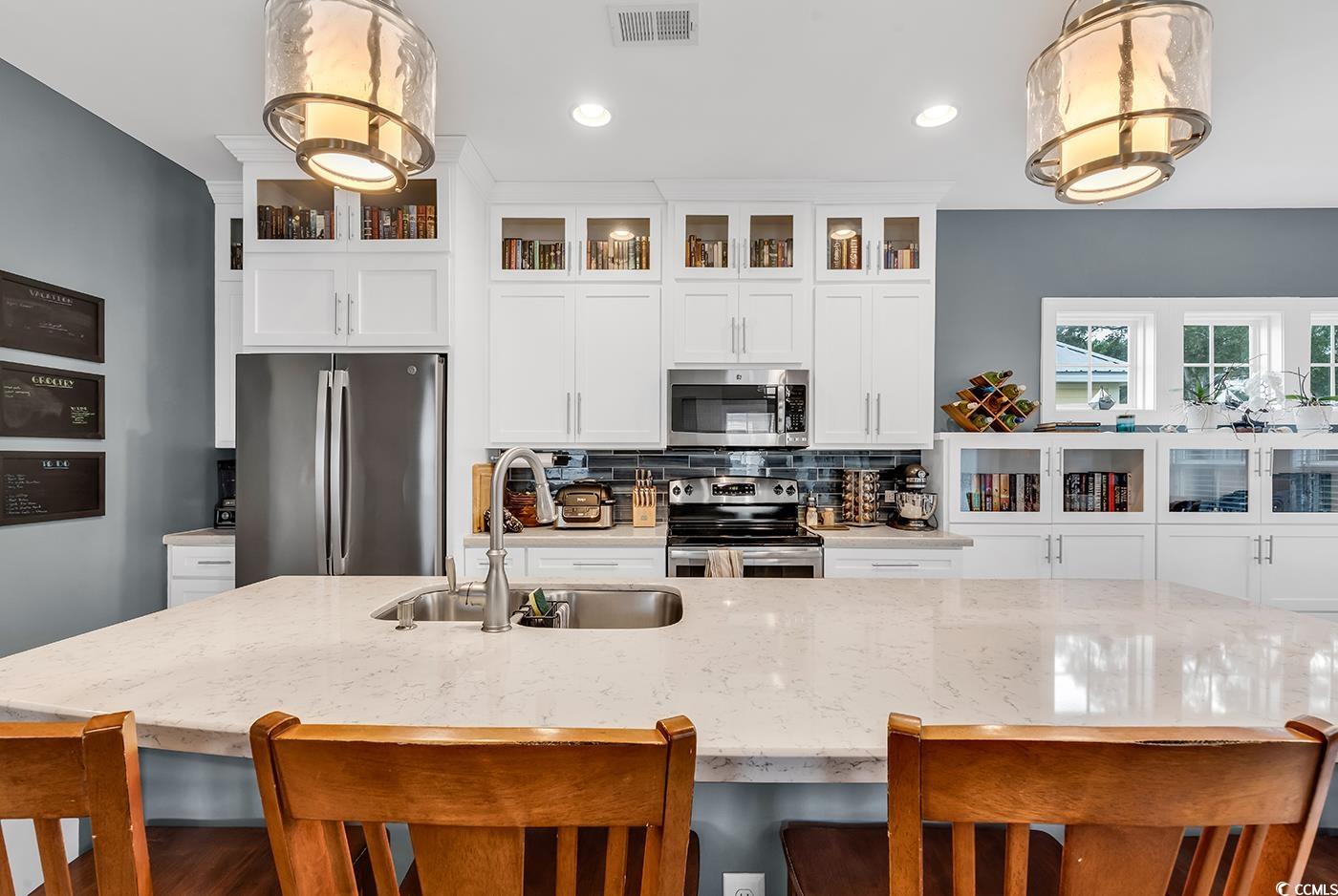 28 Pinnacle Drive Murrells Inlet, SC 29576 - Photo 10 of 40 Kitchen featuring decorative backsplash, appliance