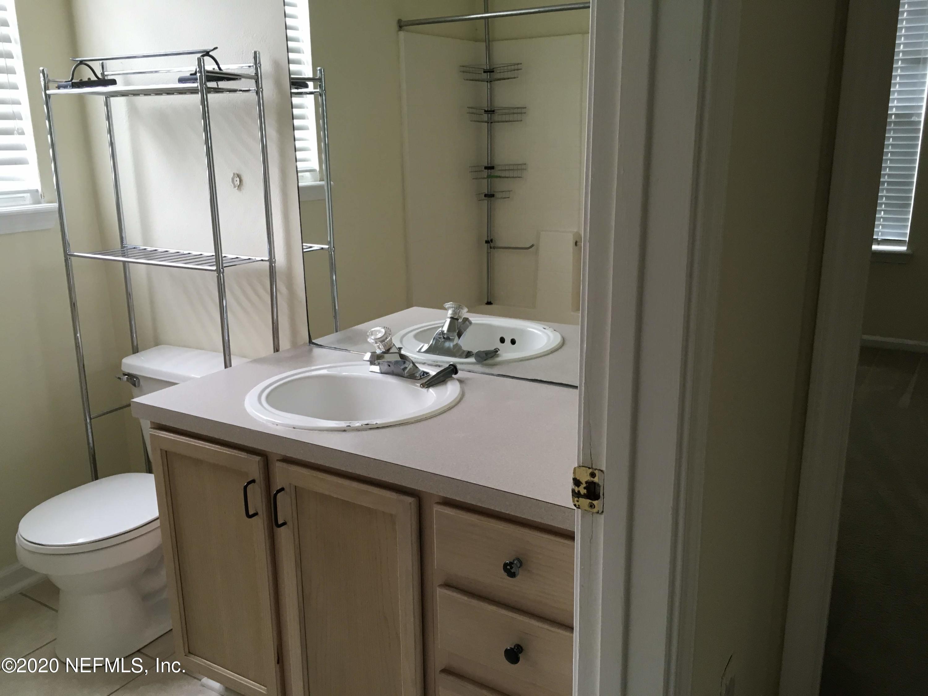 10550 Baymeadows Road, Unit 806 Jacksonville, FL 32256 - Photo 15 of 30 a bathroom with a sink toilet and shower