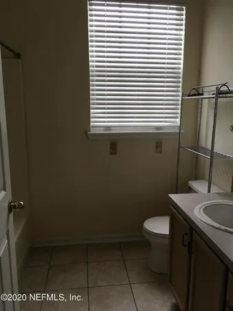 a view of an empty room with a balcony