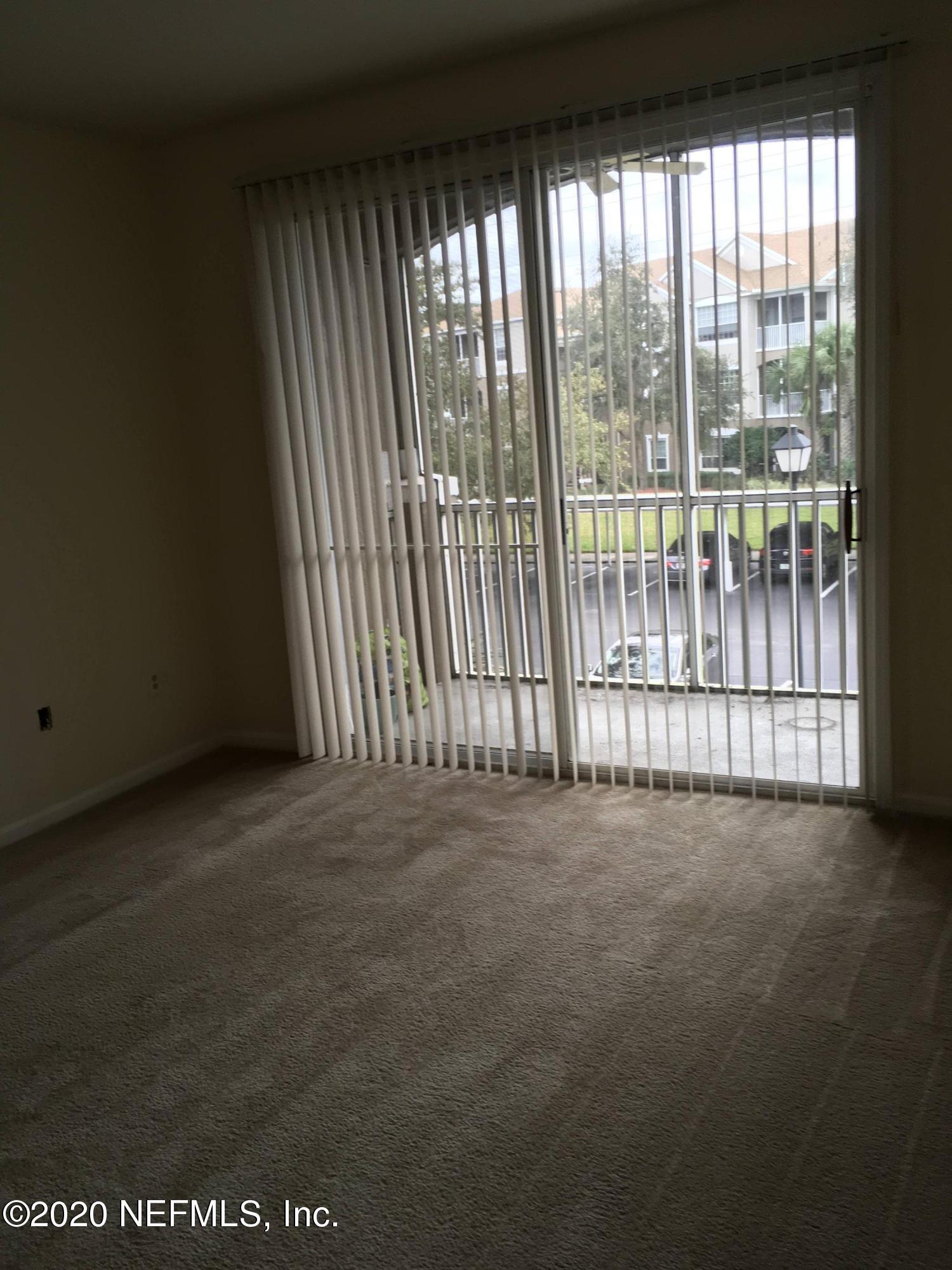 10550 Baymeadows Road, Unit 806 Jacksonville, FL 32256 - Photo 18 of 30 a view of an empty room with a balcony