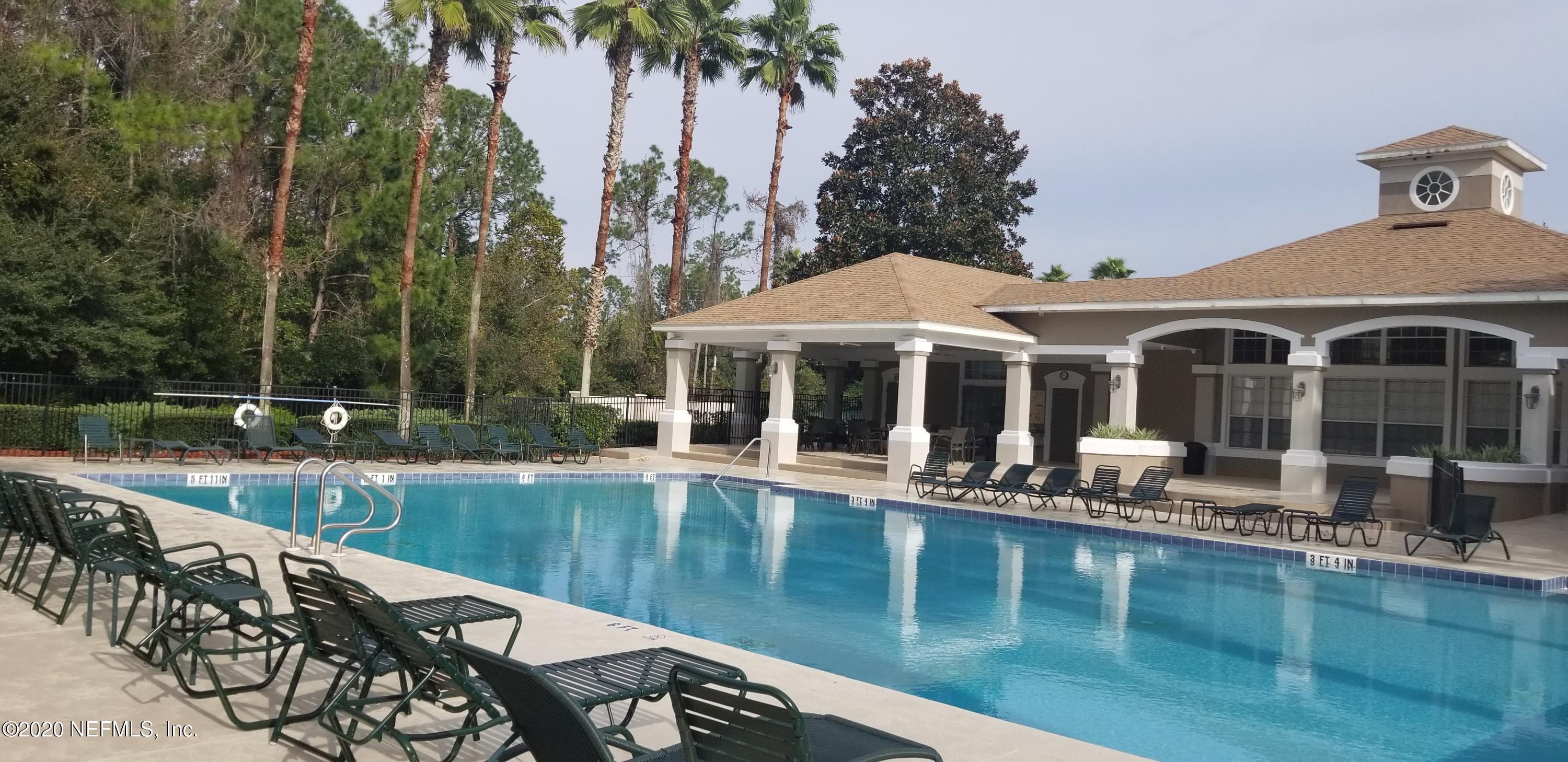 10550 Baymeadows Road, Unit 806 Jacksonville, FL 32256 - Photo 29 of 30 a view of a house with pool and sitting area