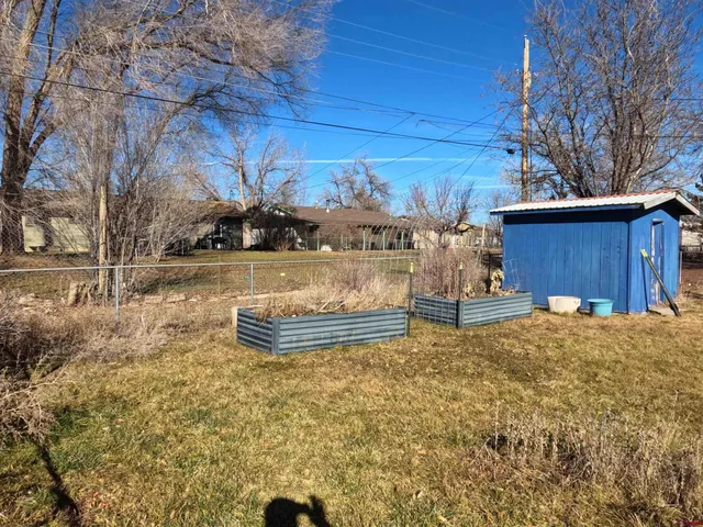 a view of a backyard of the house