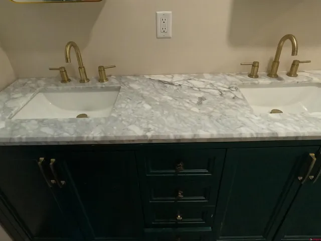 a bathroom with a sink and cabinets