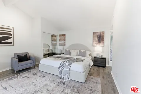 a bedroom with bed and window