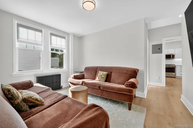 a living room with a couch and a window