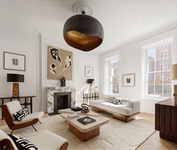 a living room with furniture a rug and a fireplace