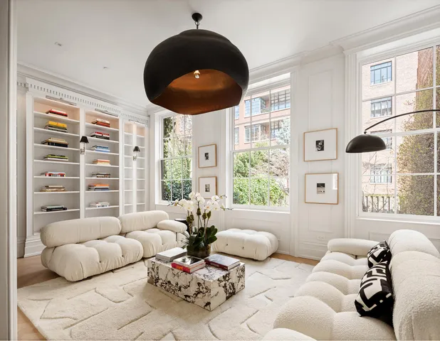 a kitchen with granite countertop a table chairs sink and wooden floor