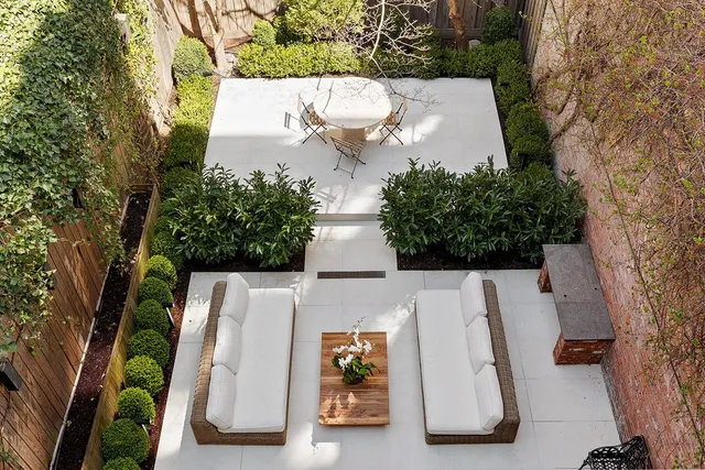 a view of a livingroom with furniture and windows