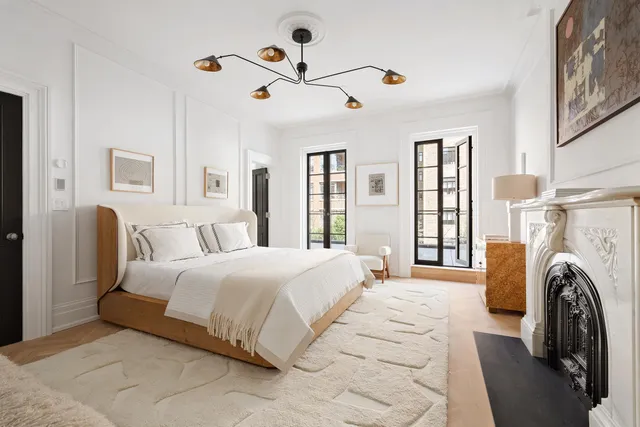 a bathroom with a sink shower and a mirror