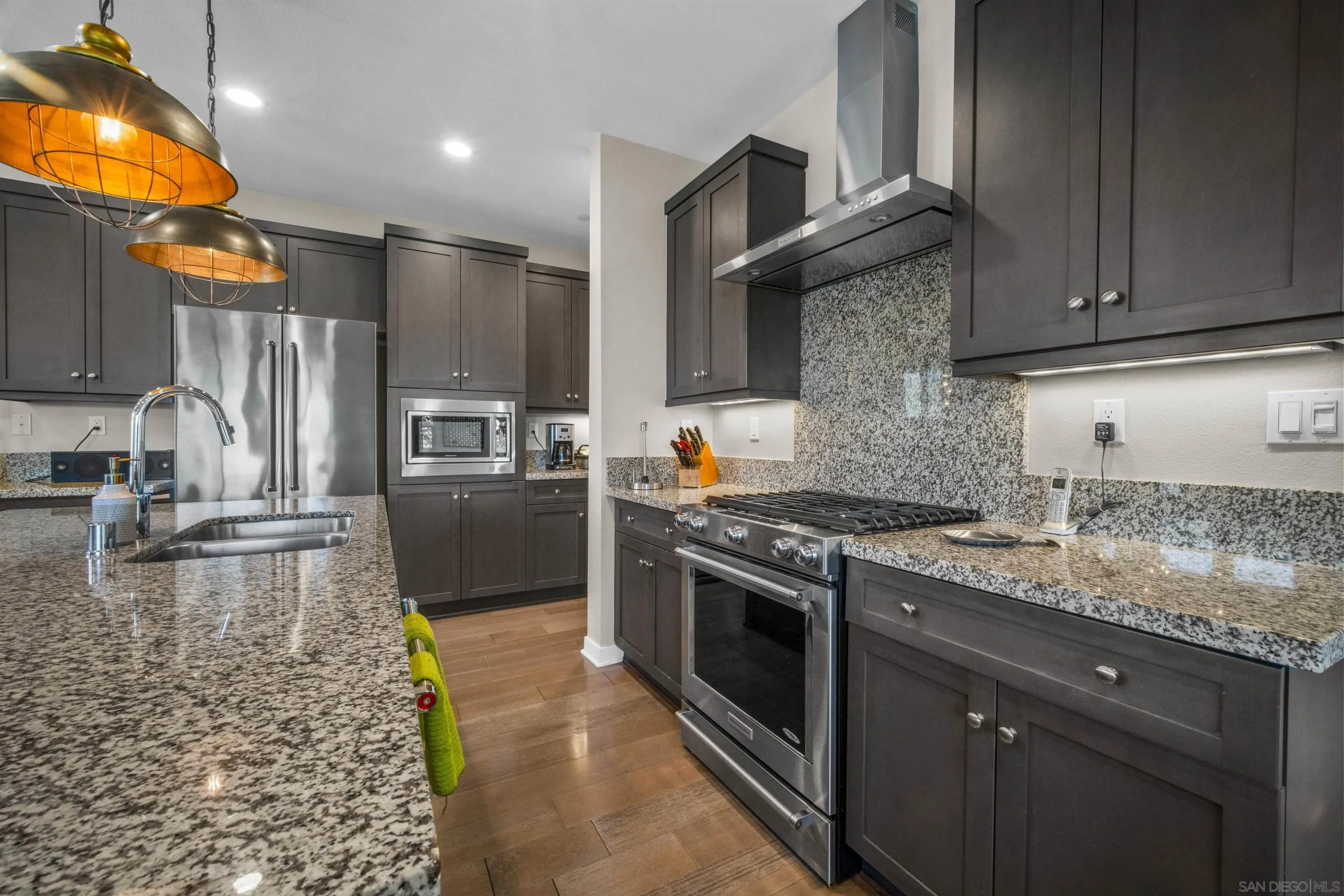 8329 Ridge Court San Diego, CA 92108 - Photo 17 of 39 a kitchen with stainless steel appliances granite countertop a stove a sink and a refrigerator