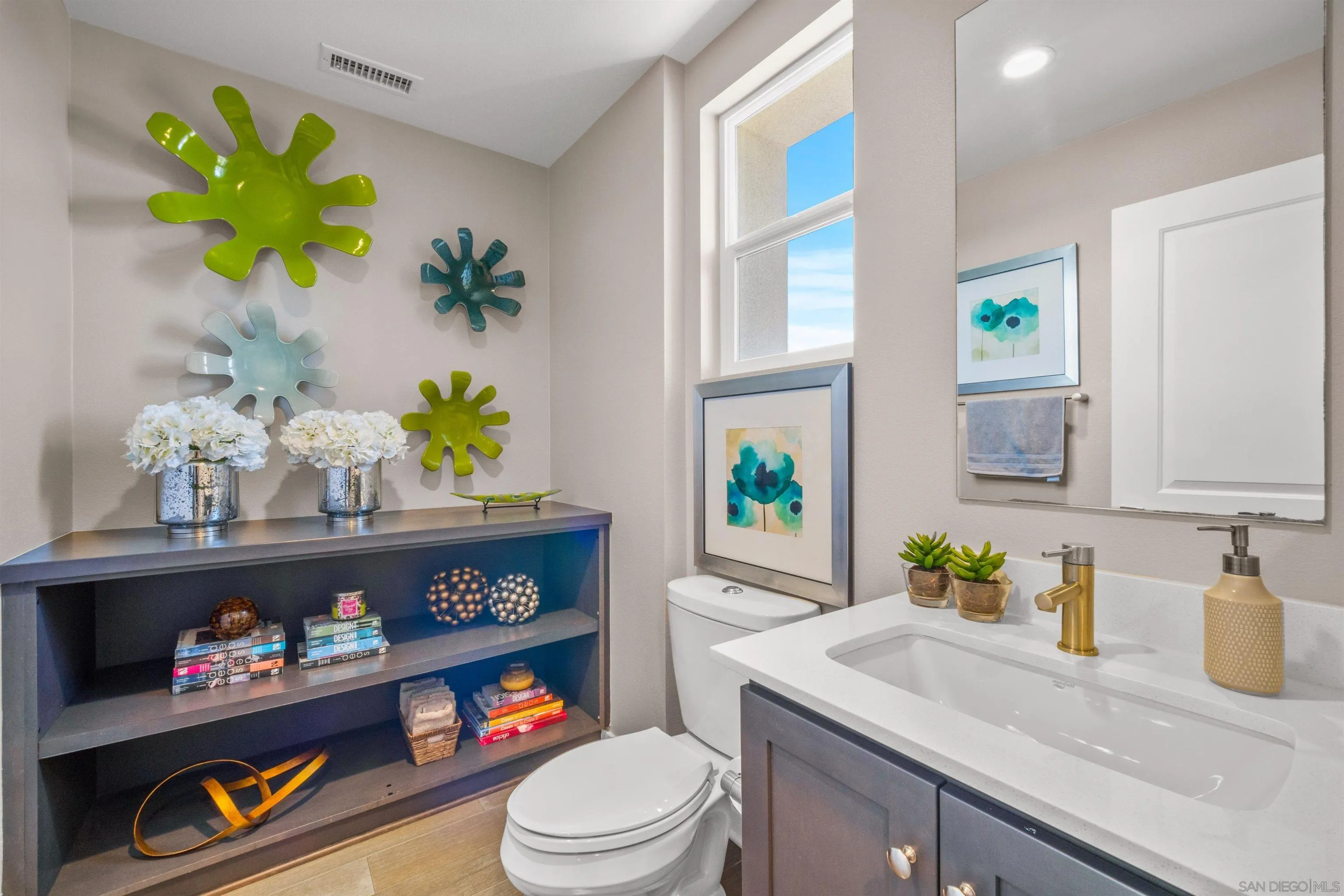8329 Ridge Court San Diego, CA 92108 - Photo 24 of 39 a bathroom with a toilet sink and mirror