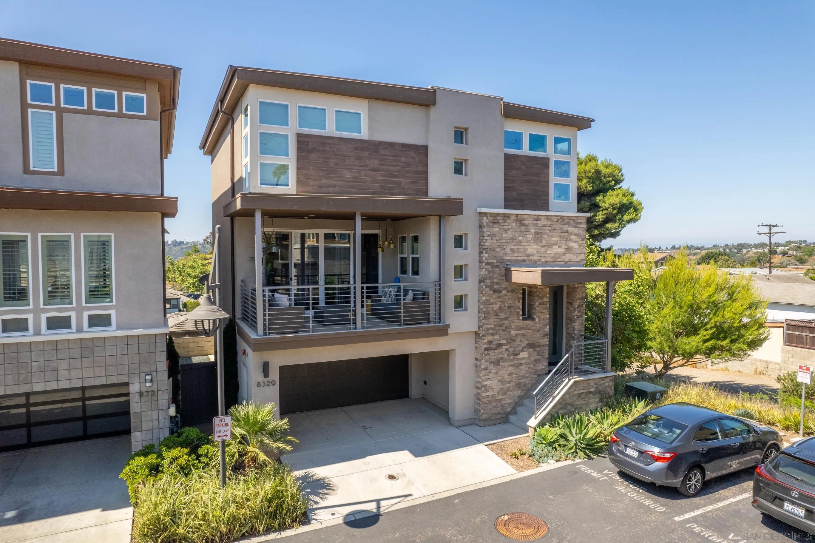 8329 Ridge Court San Diego, CA 92108 - Photo 37 of 39 a front view of a house with a garden and parking
