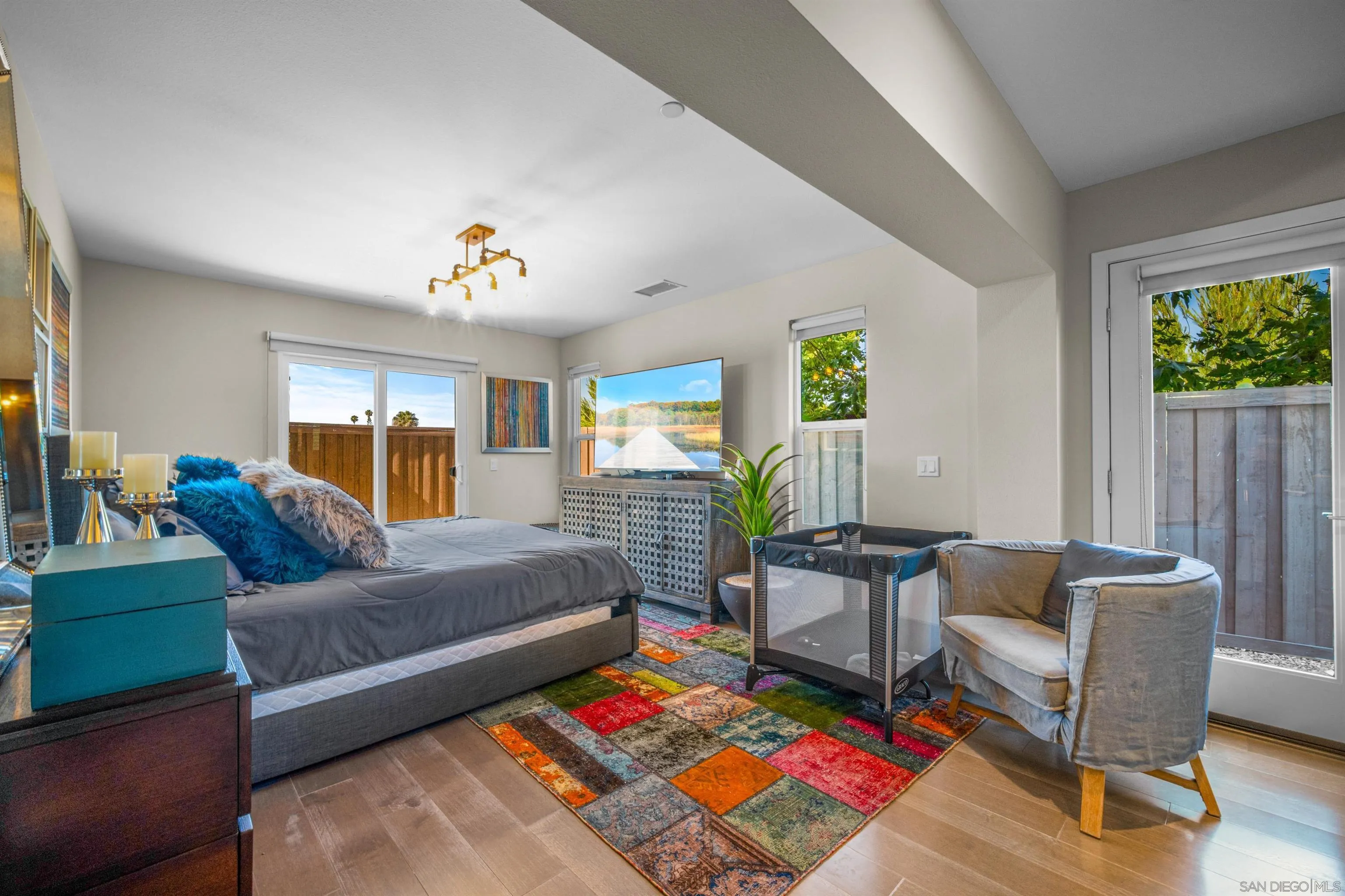 8329 Ridge Court San Diego, CA 92108 - Photo 7 of 39 a living room with furniture and a baby crib