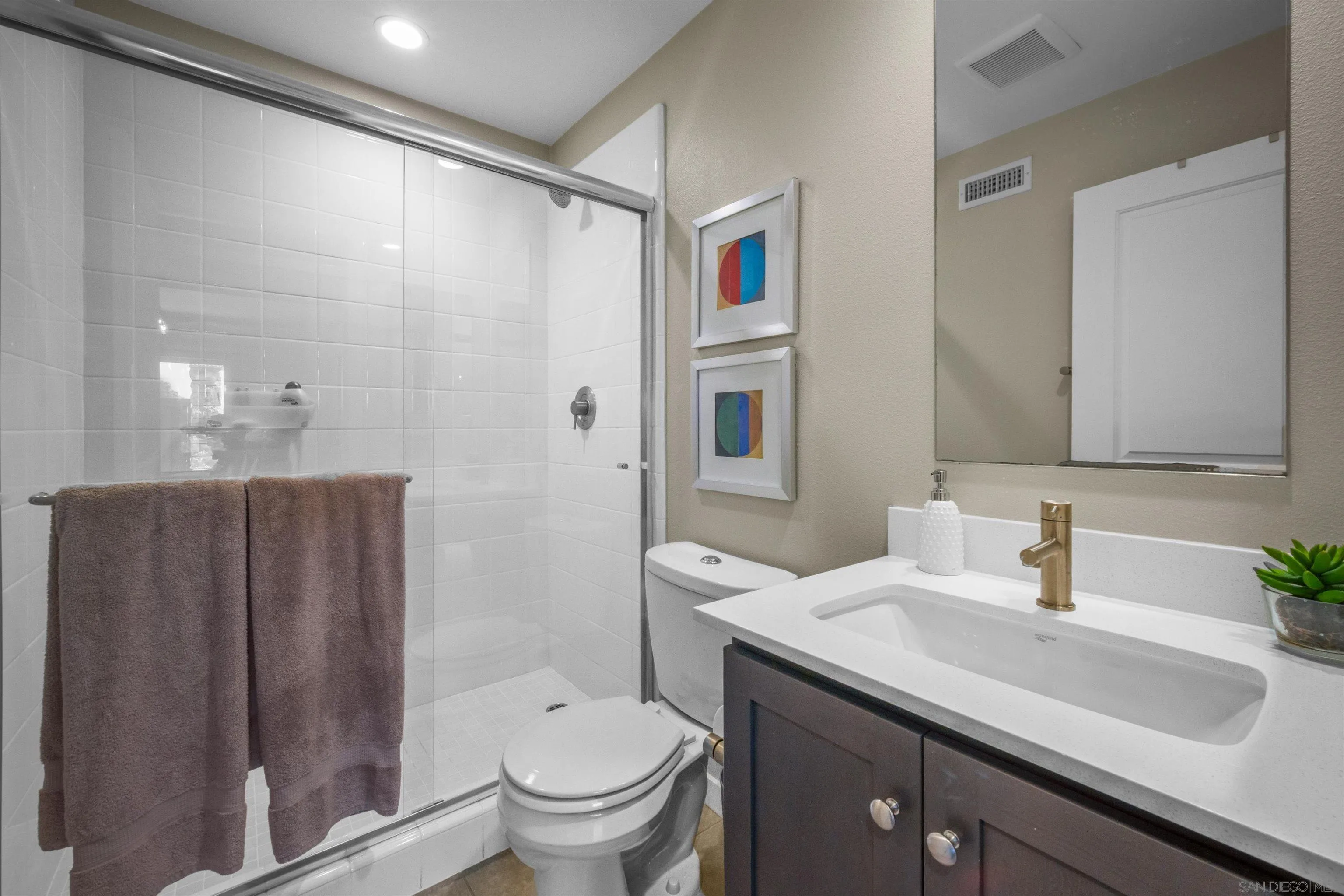 8329 Ridge Court San Diego, CA 92108 - Photo 8 of 39 a bathroom with a granite countertop sink toilet and shower