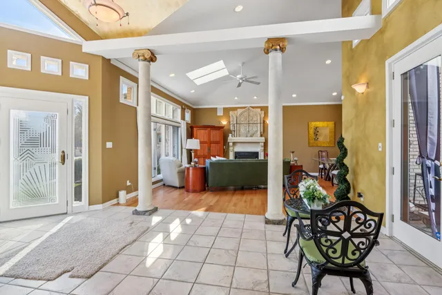 a large kitchen with kitchen island a large counter space a sink appliances and cabinets