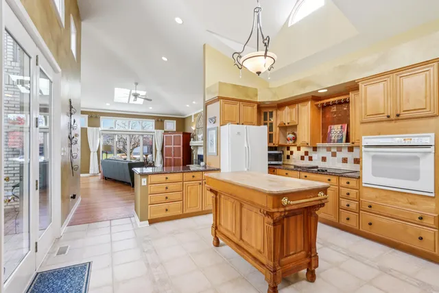a bed sitting in a room next to a large window
