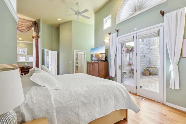 a bed room with a bed and a chandelier