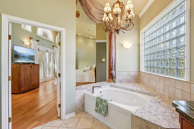 a bedroom with a bed and a potted plant