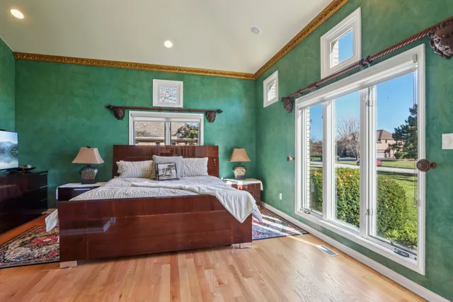 a view of a brick house with potted plants
