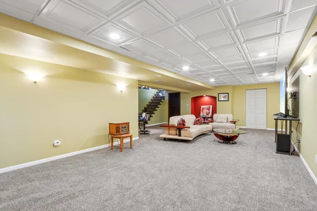 an aerial view of residential building and lake