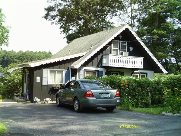 17 Beaver Road Ware, MA 01082 - Photo 2 of 5 a front view of a house with a yard