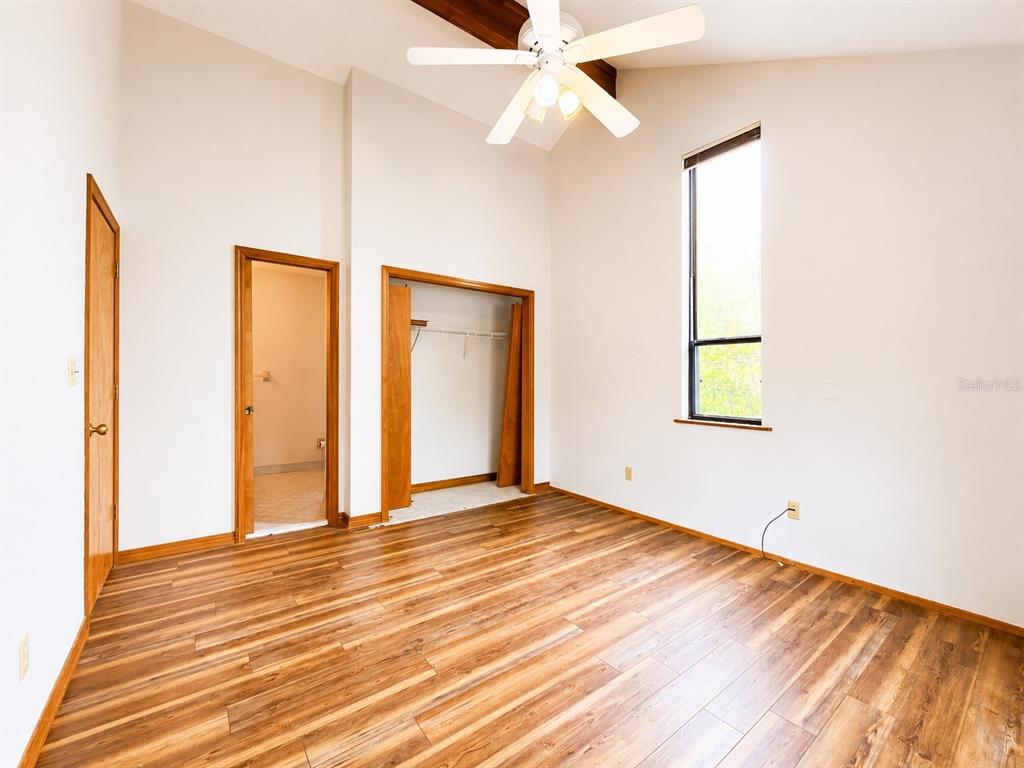 7119 Immokalee Road Keystone Heights, FL 32656 - Photo 25 of 50 a view of an empty room with wooden floor