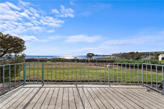 a view of a lake with a yard