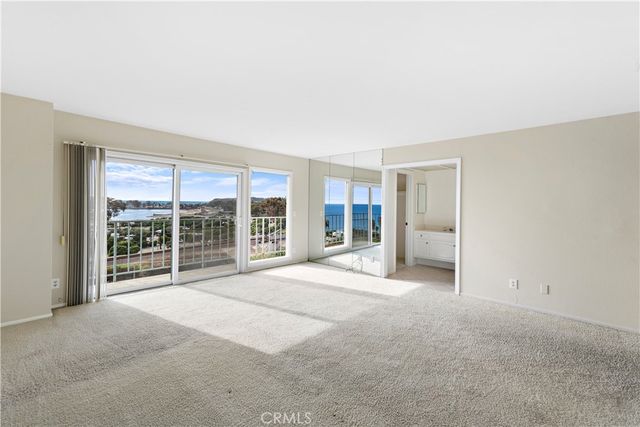 a view of an empty room with a balcony