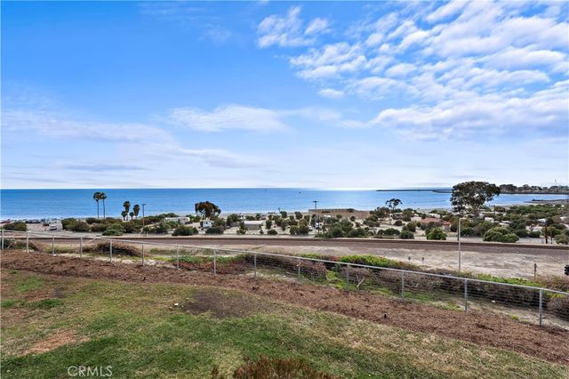 a view of a lake with tall buildings