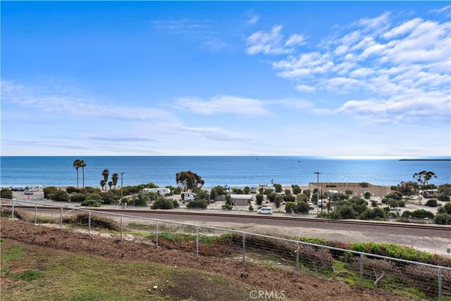 a view of a water with an outdoor seating