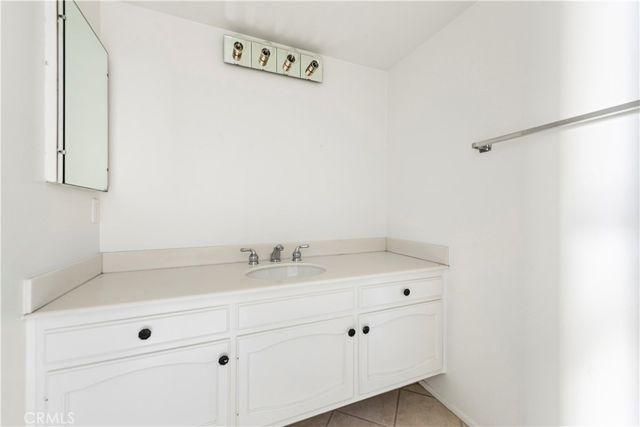 a bathroom with a sink and vanity