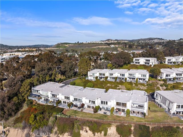 a view of a city with mountains in the background