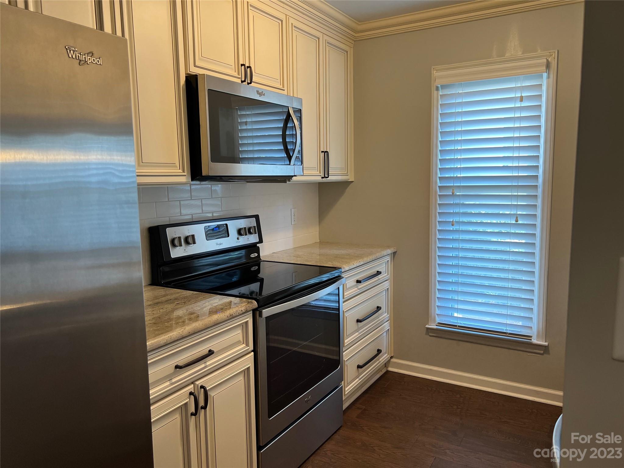 226 Queens Road Charlotte, NC 28204 - Photo 13 of 24 a kitchen with a stove and a microwave