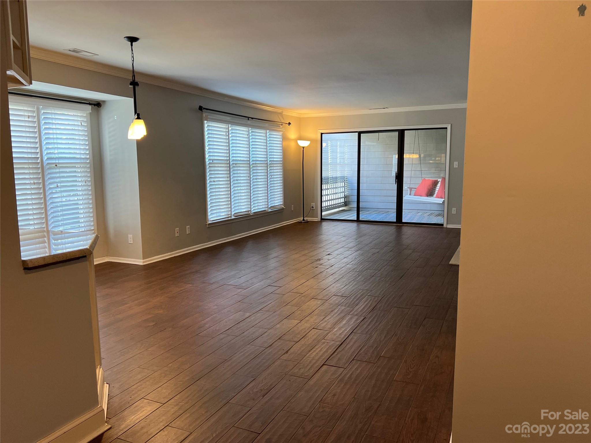 226 Queens Road Charlotte, NC 28204 - Photo 19 of 24 an empty room with wooden floor and windows