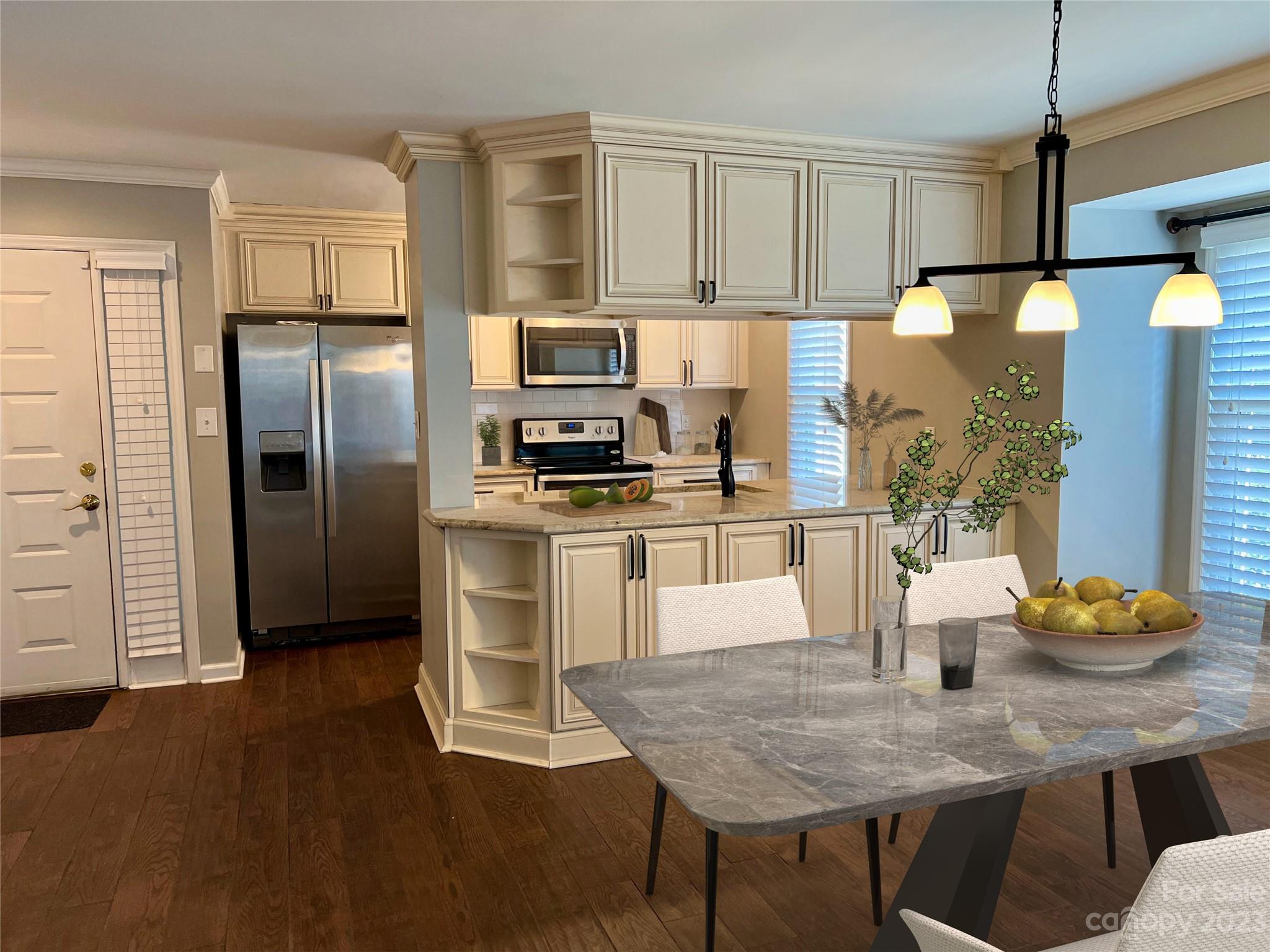 226 Queens Road Charlotte, NC 28204 - Photo 4 of 24 a kitchen with stainless steel appliances granite countertop a stove refrigerator a sink dishwasher and microwave