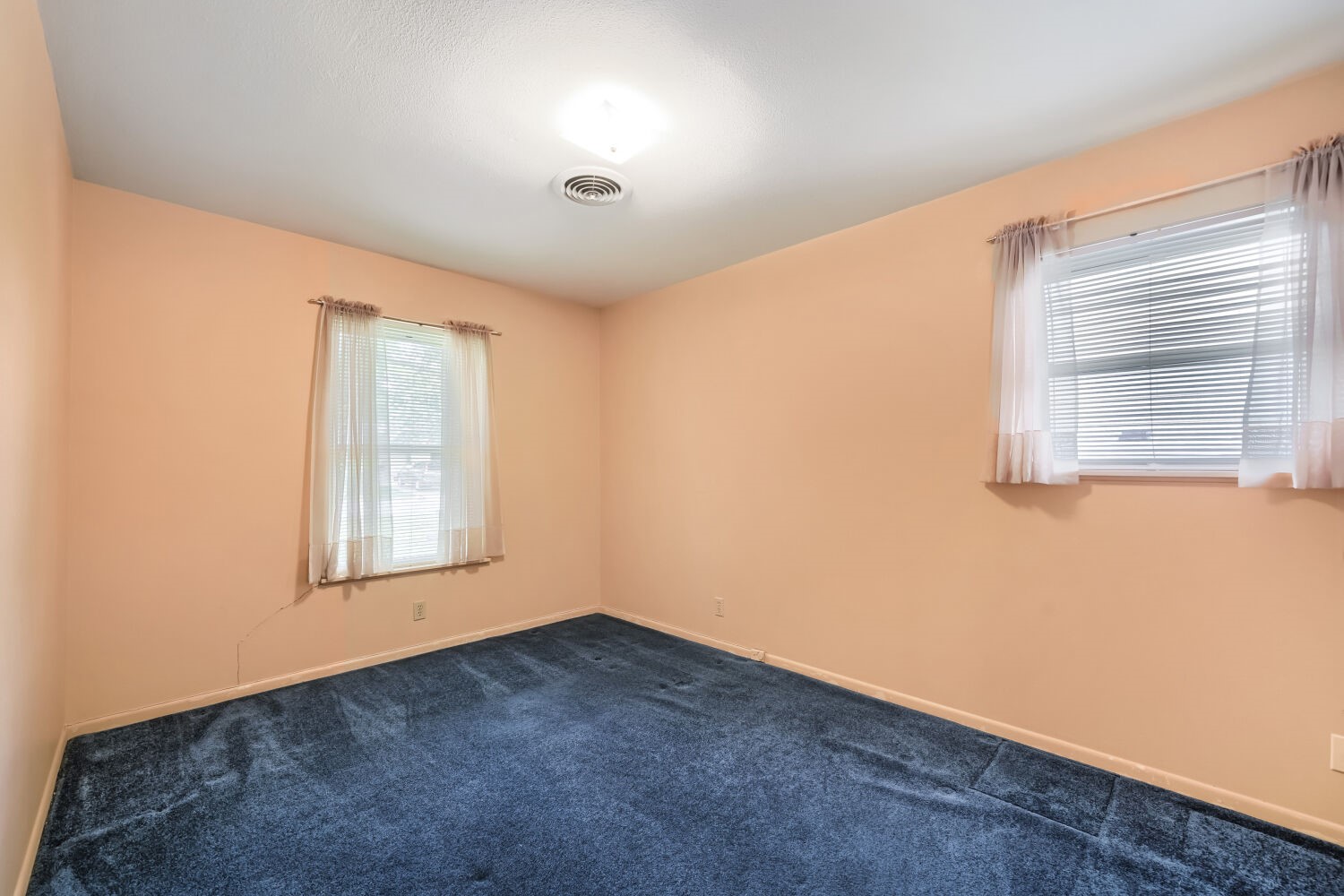 1909 Burbank Street Austin, TX 78757 - Photo 11 of 17 an empty room with windows