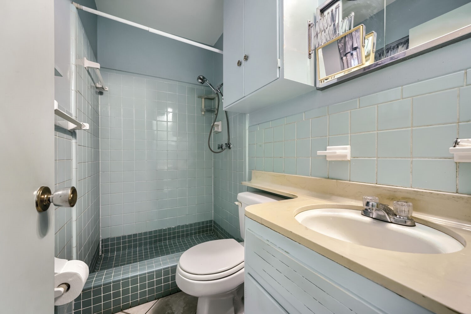 1909 Burbank Street Austin, TX 78757 - Photo 12 of 17 a bathroom with a sink toilet vanity and shower