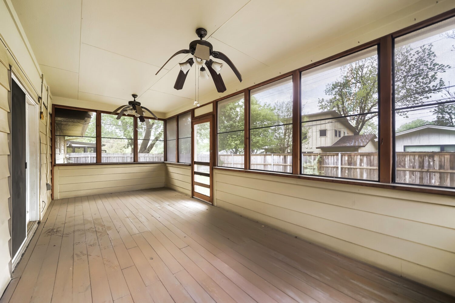 1909 Burbank Street Austin, TX 78757 - Photo 14 of 17 a view of room with window and wooden floor