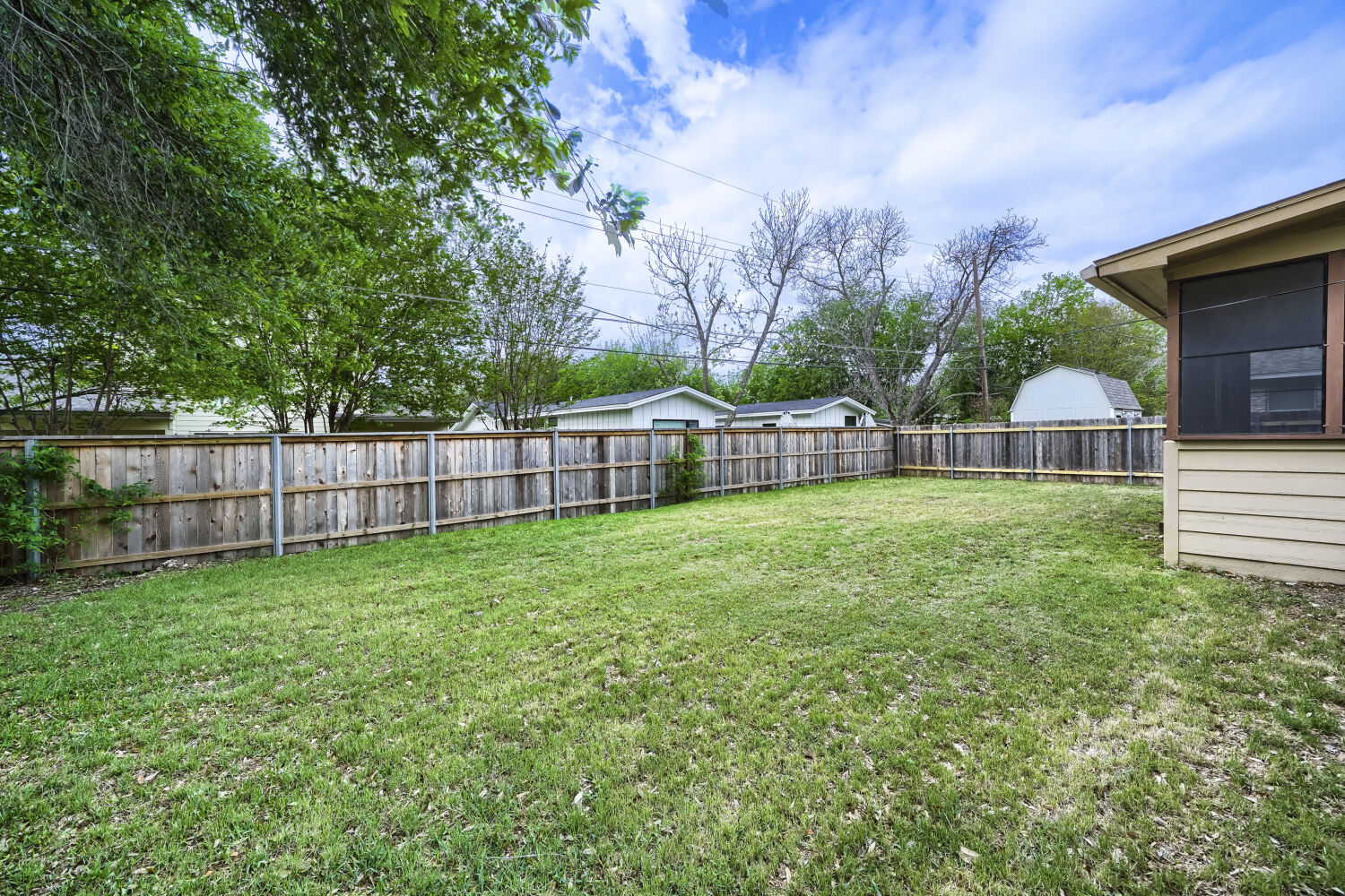 1909 Burbank Street Austin, TX 78757 - Photo 16 of 17 a view of a house with backyard and sitting area
