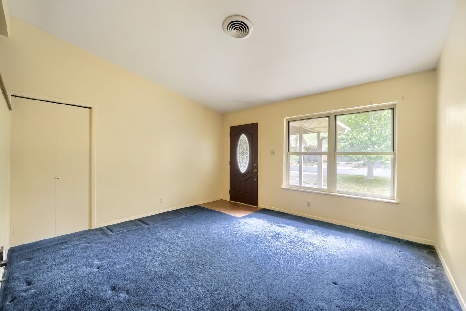 1909 Burbank Street Austin, TX 78757 - Photo 4 of 17 an empty room with air conditioner and windows