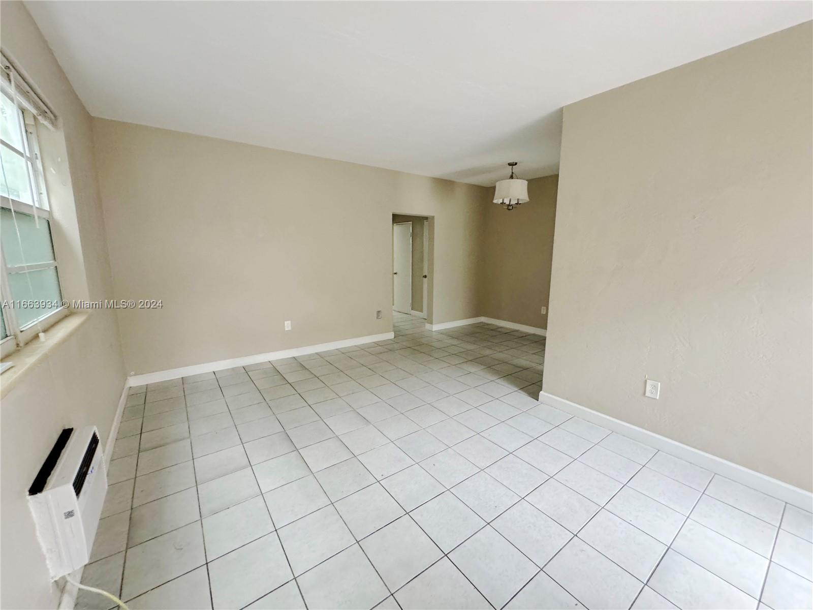 620 76th Street, Unit 7 Miami Beach, FL 33141 - Photo 3 of 17 a view of an empty room and window